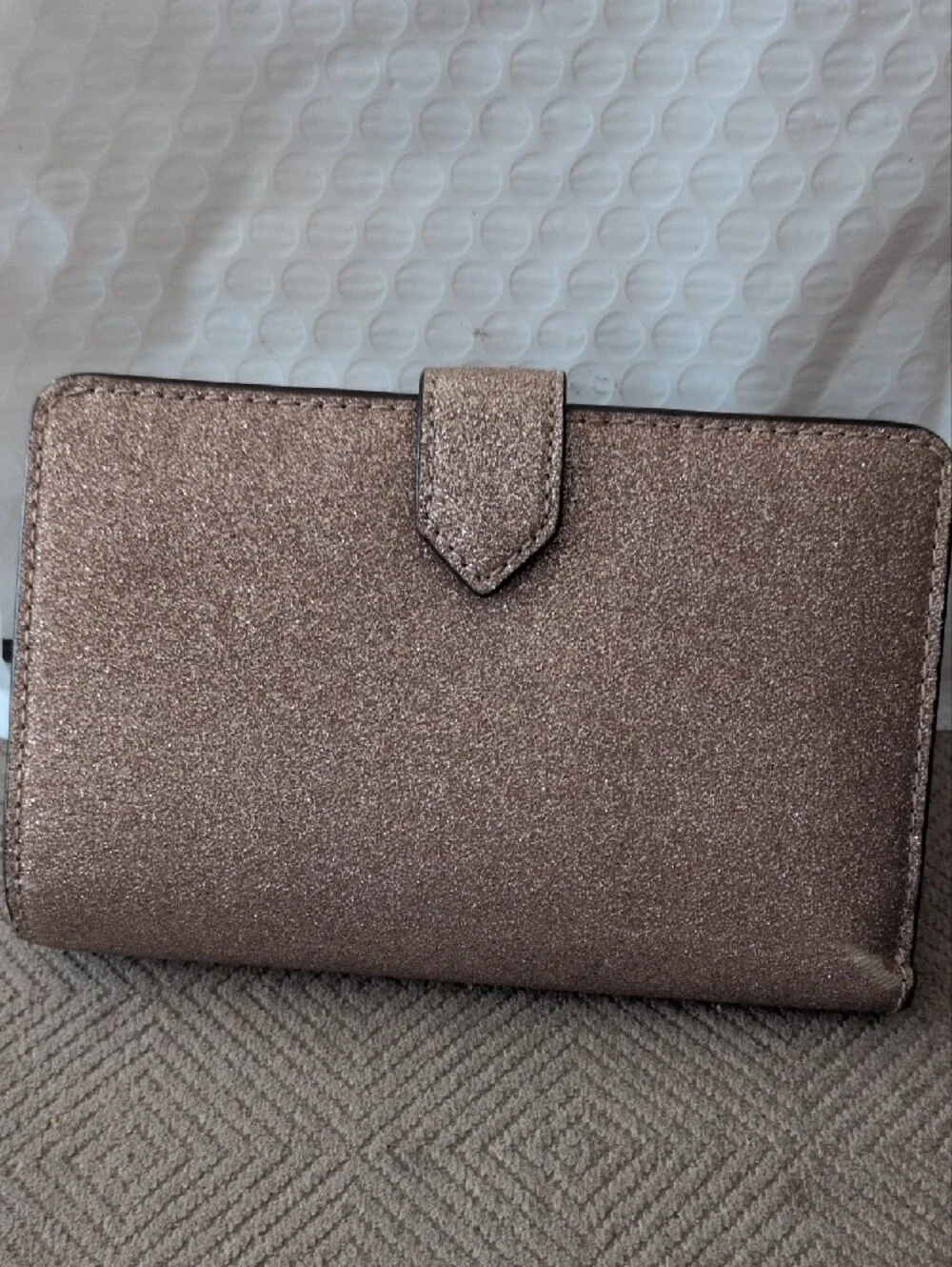 kate spade glitter wallet in rose gold shimmer